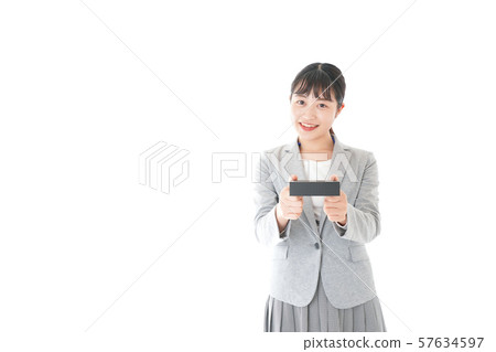 Young business woman handing present Young business woman handing present 57634597