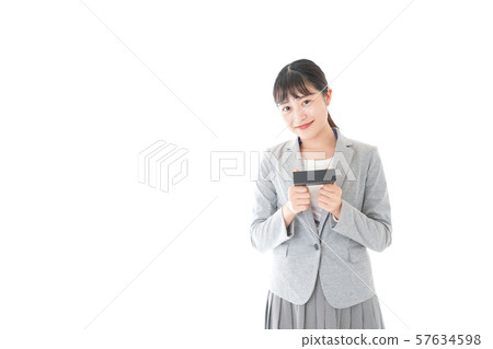 Young business woman handing present Young business woman handing present 57634598