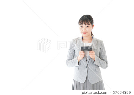 Young business woman handing present Young business woman handing present 57634599