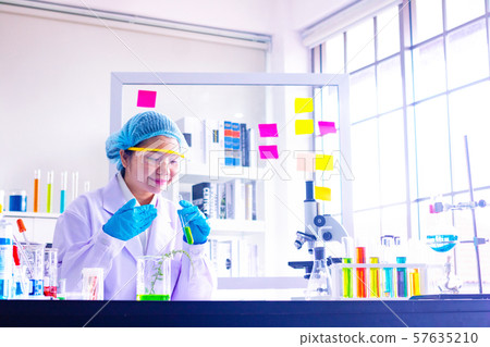 Body past scientist working in laboratory.Chemical scientist holding test tube and chemical inhalation.She Experiment,chemical,study.Photo concept develop and medicine. 57635210
