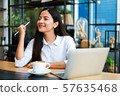 Asian woman in cafe 57635468