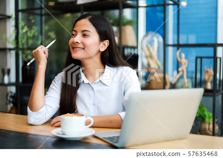 Asian woman in cafe Asian woman in cafe 57635468