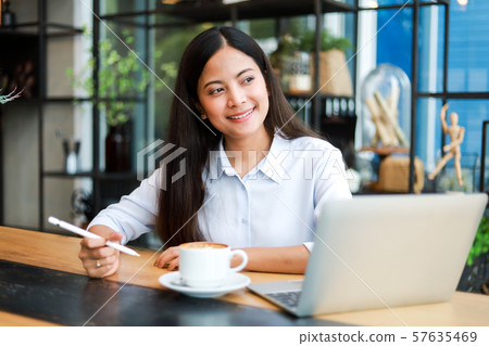 Asian woman in cafe Asian woman in cafe 57635469