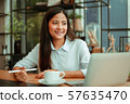 Asian woman in cafe 57635470
