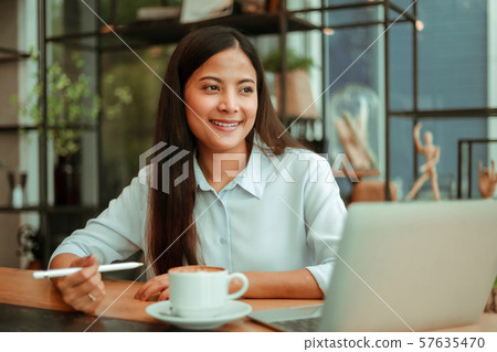 Asian woman in cafe Asian woman in cafe 57635470