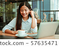 Asian woman in cafe 57635471