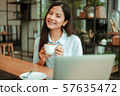 Asian woman in cafe 57635472