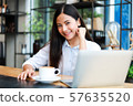 Asian woman in cafe 57635520