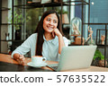 Asian woman in cafe 57635522