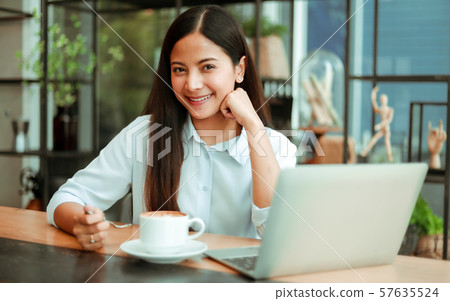 Asian woman in cafe Asian woman in cafe 57635524