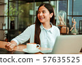 Asian woman in cafe 57635525