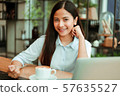 Asian woman in cafe 57635527