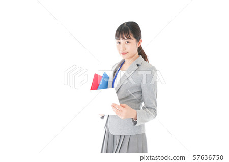 Young business woman checking office documents Young business woman checking office documents 57636750