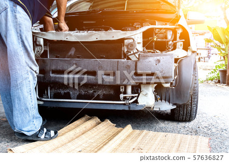 Mechanic repairs car and maintains vehicle  57636827