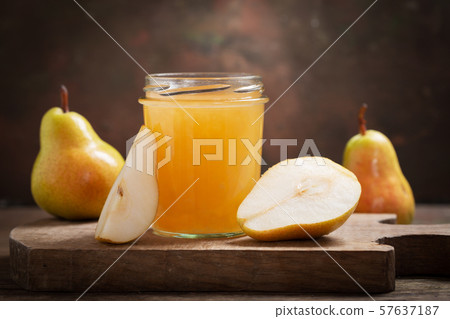glass jar of pear jam with fresh fruits 57637187