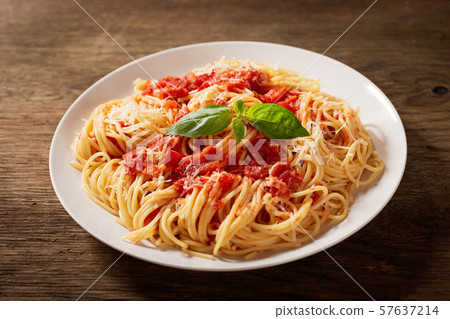 plate of pasta with tomato sauce 57637214