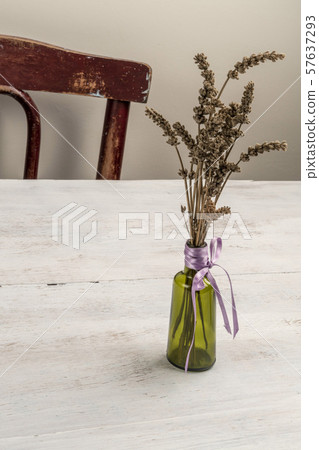 lavender bouquet in a vase on a wooden table at lavender bouquet in a vase on a wooden table at 57637293