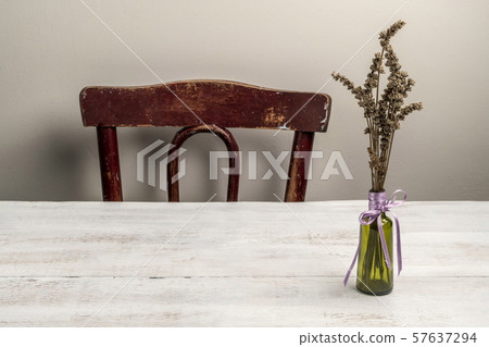 lavender bouquet in a vase on a wooden table at lavender bouquet in a vase on a wooden table at 57637294