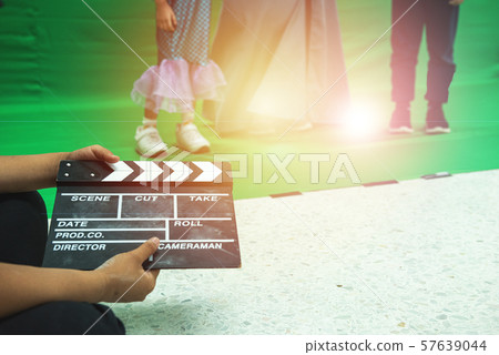 Hands hold black Clapperboard or movie slate. Hands hold black Clapperboard or movie slate. 57639044