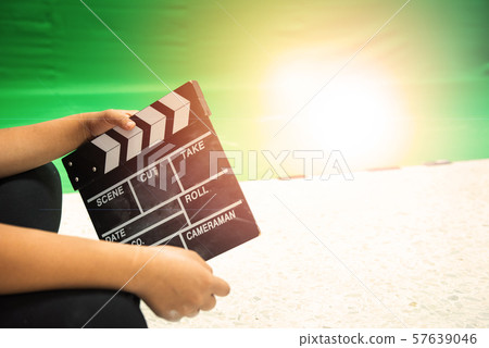 Hands hold black Clapperboard or movie slate. Hands hold black Clapperboard or movie slate. 57639046