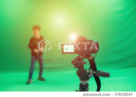 Videographer taking video camera, camera equipment Videographer taking video camera, camera equipment 57639047