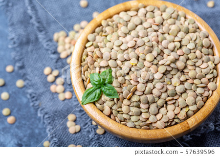 Brown organic dried lentils close up. Brown organic dried lentils close up. 57639596