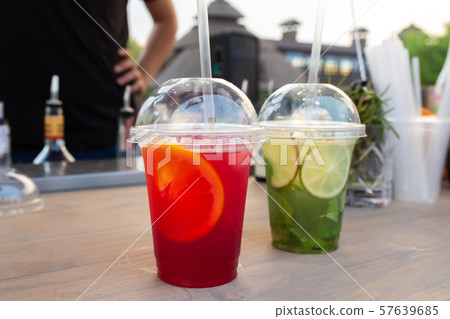 A counter with multi-colored fruit cocktails in A counter with multi-colored fruit cocktails in 57639685
