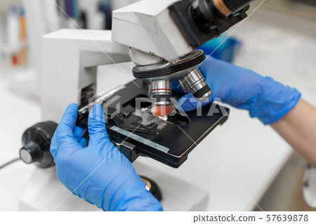 Close up lab technician research blood sample in Close up lab technician research blood sample in 57639878