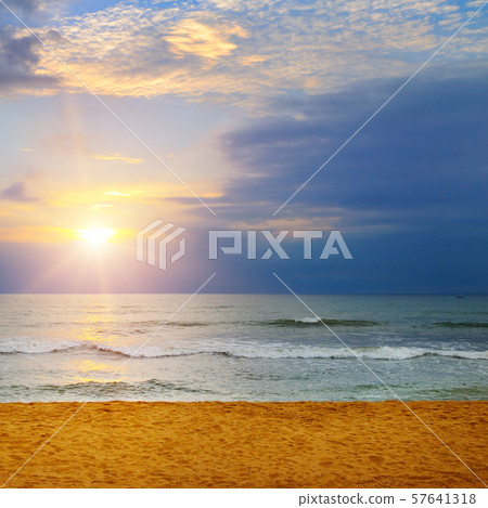 Beach of the ocean and sunrise. 57641318