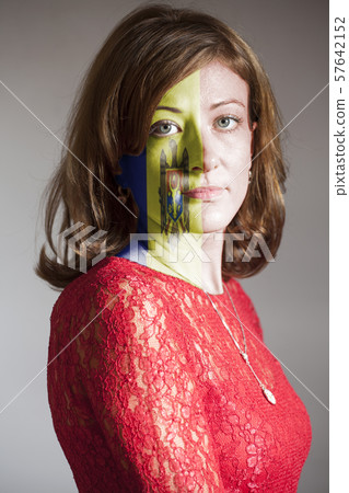Woman face with painted Moldova flag 57642152