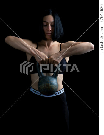 beautiful athletic girl with black hair raised 57642626