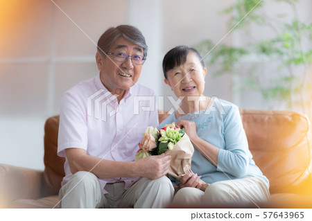 Two people gift celebration celebration old man old age interior design room white natural light renovation 57643965