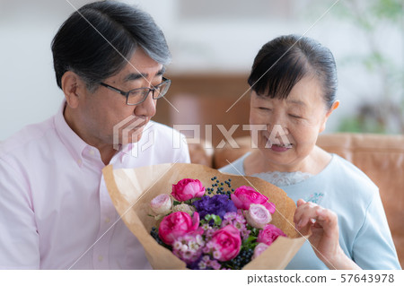 Two people gift celebration celebration old man old age interior design room white natural light renovation 57643978
