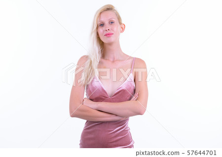 Young beautiful blonde woman with arms crossed ready to party Young beautiful blonde woman with arms crossed ready to party 57644701
