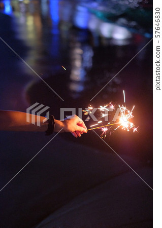 Hand held fireworks at the sea 57646830
