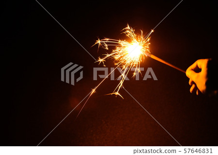 Hand held fireworks at the sea 57646831