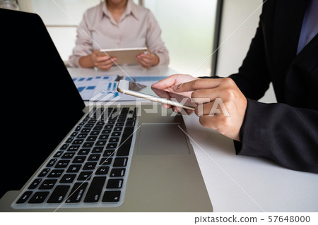 Two business leader women discussing the charts, graphs and showing the results for planning management new project 57648000