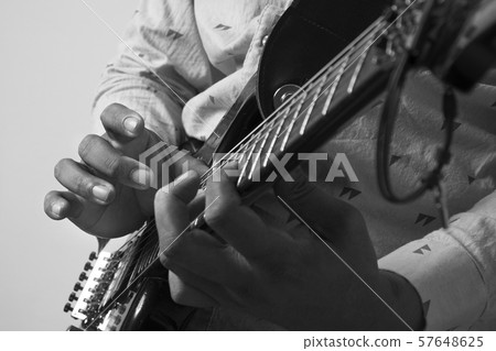 Male Guitar Musician Playing His Electric Guitar. Male Guitar Musician Playing His Electric Guitar. 57648625