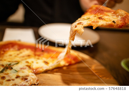 Pizza growing cheese 57648818