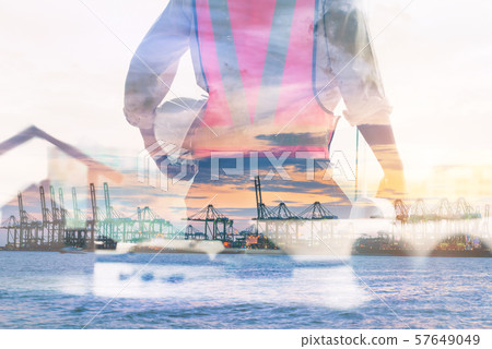 Double Exposure of Engineer in Safety Equipment on Shipping Terminal Industry Background 57649049