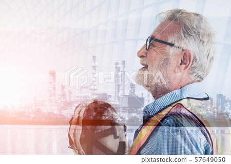 Double Exposure of Engineer in Safety Equipment on Oil/Gas Refinery Industry Plant Background 57649050