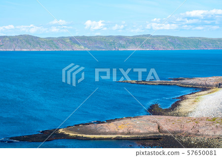 The shore of the Barents Sea (The Arctic ocean), view from the cliff. Near Teriberka, Murmansk, Russia. Wonderful sea landscape  57650081