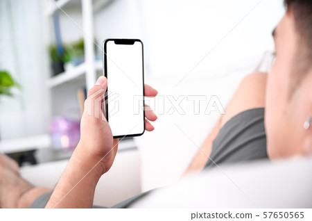 male hands holding phone with isolated screen on 57650565