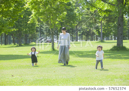 Families playing in the park Families playing in the park 57652374