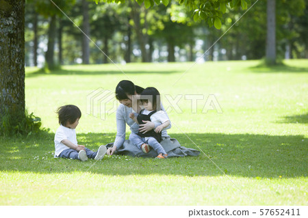 Families playing in the park Families playing in the park 57652411