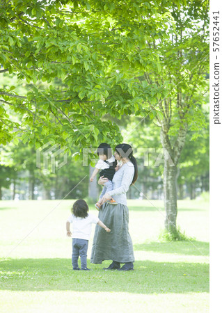 Families playing in the park Families playing in the park 57652441