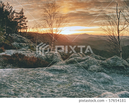 Hills silhouettes and fog filled valleys with 57654181