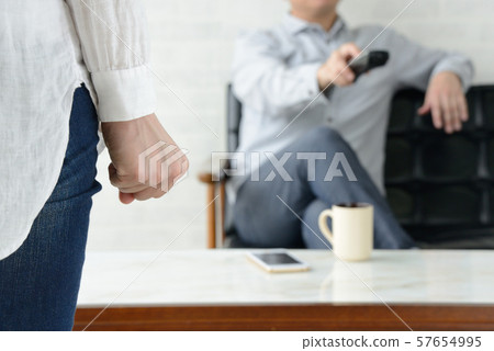 Housewife frustrated with husband who does not help with housework 57654995