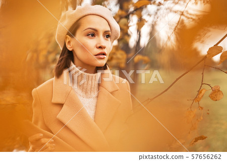 Beautiful lady surrounded autumn leaves Beautiful lady surrounded autumn leaves 57656262