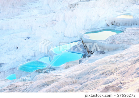 Natural Pamukkale travertine terraces filled with blue water 57656272